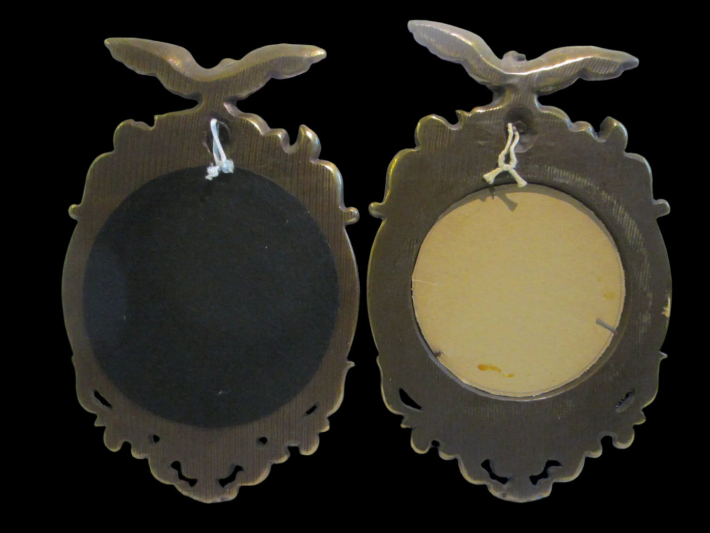 A Pair of Colonial Antiqued Eagle Crest Mid Century Convex Mirrors