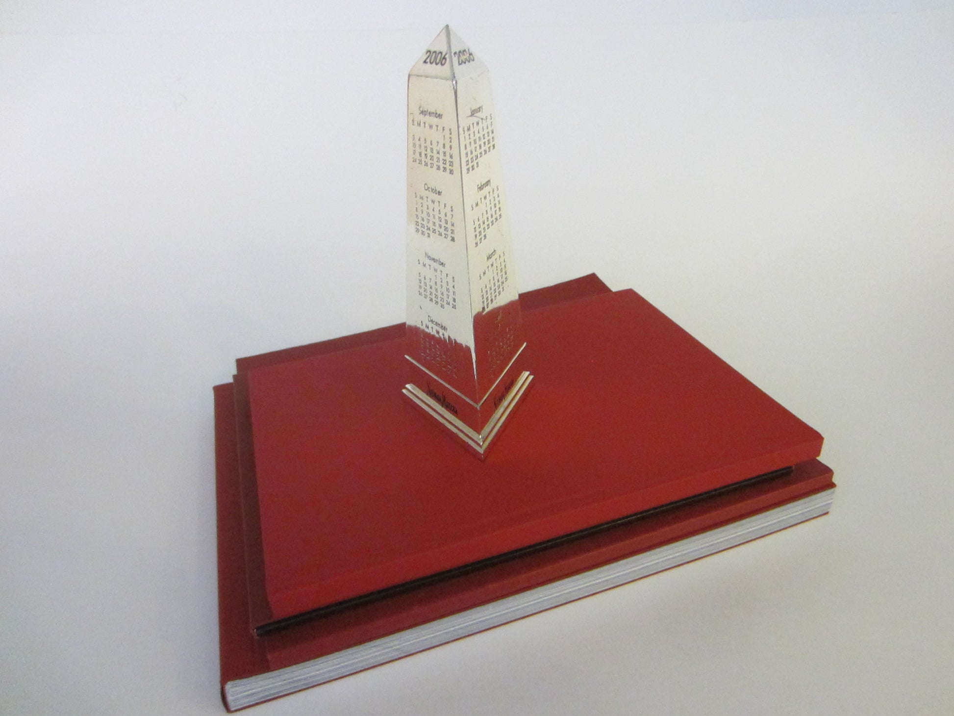 Obelisk Nickel Paperweight 2006 Calendar Neiman Marcus Exclusive - Designer Unique Finds 