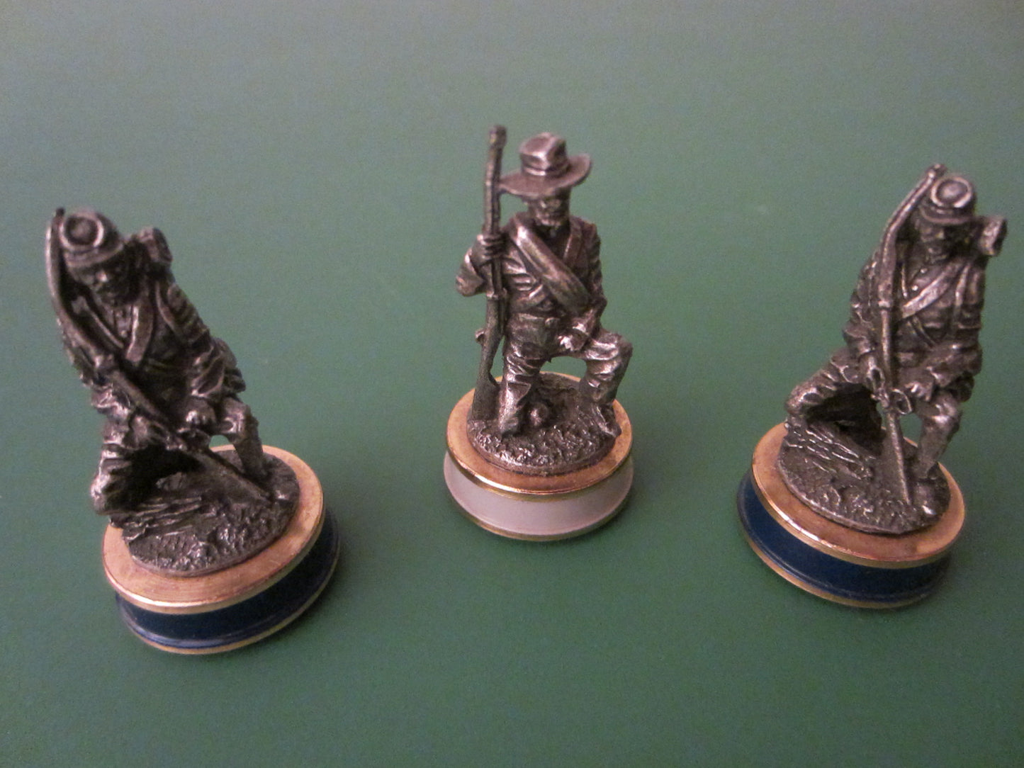 Three Pewter Miniature Figures Enameled Stands Symbolic Marks